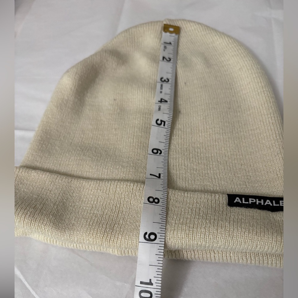 Alphalete unisex beanie. Off white. Good condition.